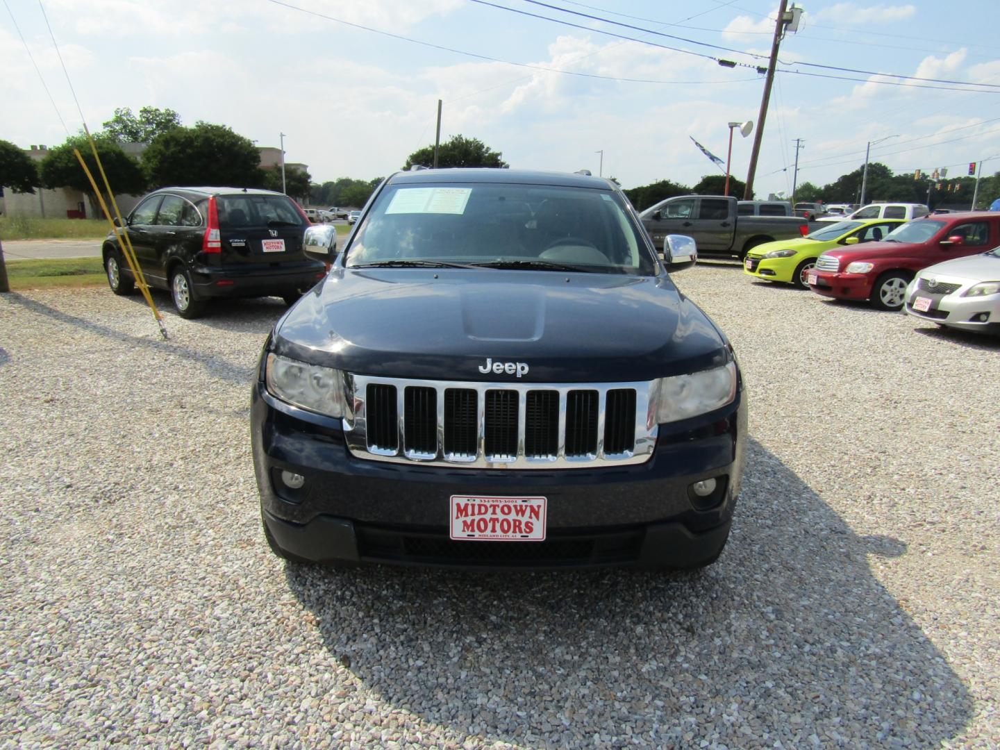 2013 Blue /Tan Jeep Grand Cherokee Laredo 2WD (1C4RJEAG1DC) with an 3.6L V6 DOHC 24V engine, Automatic transmission, located at 15016 S Hwy 231, Midland City, AL, 36350, (334) 983-3001, 31.306210, -85.495277 - Photo#1